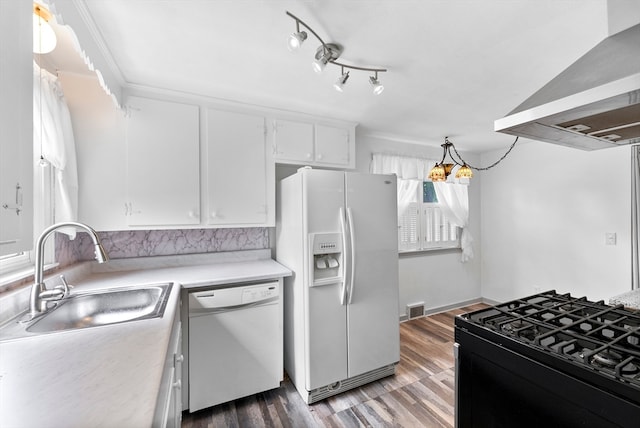 kitchen with white appliances, sink, dark hardwood / wood-style floors, ventilation hood, and white cabinets