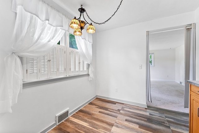 interior space with hardwood / wood-style flooring