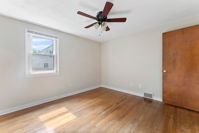 unfurnished room with ceiling fan and light hardwood / wood-style floors