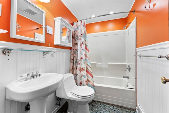 bathroom featuring toilet and shower / tub combo with curtain