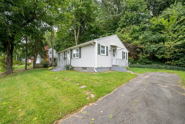 view of home's exterior featuring a yard