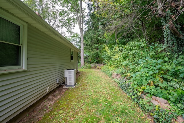 view of yard with central AC unit