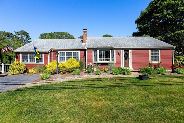 128 S Sea Ave, Yarmouth, MA 02673 - ranch-style house featuring a chimney and a front lawn