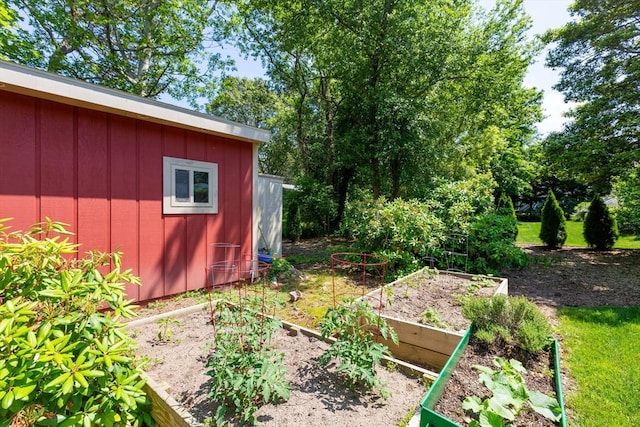 128 S Sea Ave, Yarmouth, MA 02673 - view of yard with a vegetable garden and an outbuilding