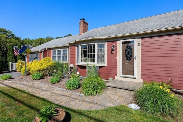 128 S Sea Ave, Yarmouth, MA 02673 - entrance to property featuring a chimney