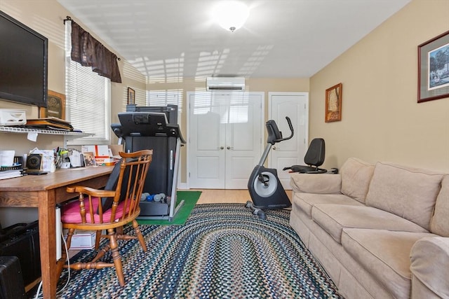 128 S Sea Ave, Yarmouth, MA 02673 - living area featuring a wall unit AC, light wood-style floors, and a desk