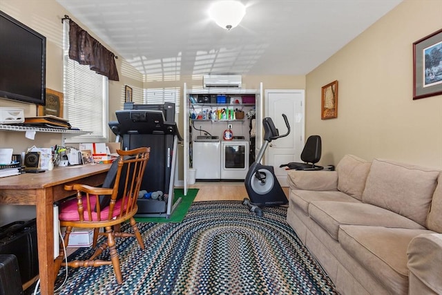 128 S Sea Ave, Yarmouth, MA 02673 - living area featuring independent washer and dryer, light wood-style flooring, and an AC wall unit
