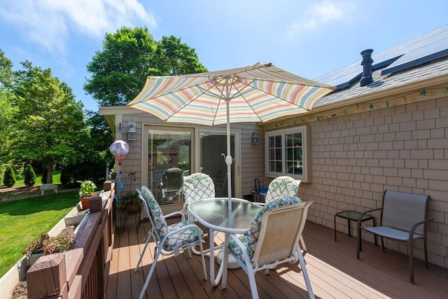 128 S Sea Ave, Yarmouth, MA 02673 - wooden deck featuring outdoor dining area and a yard