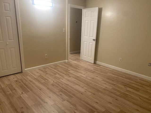 unfurnished room with light hardwood / wood-style floors