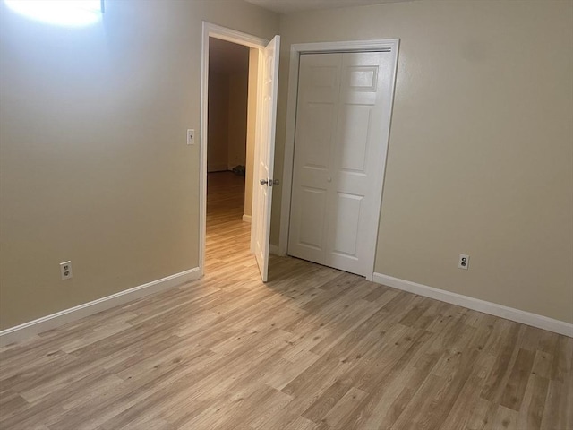 unfurnished room featuring light hardwood / wood-style flooring