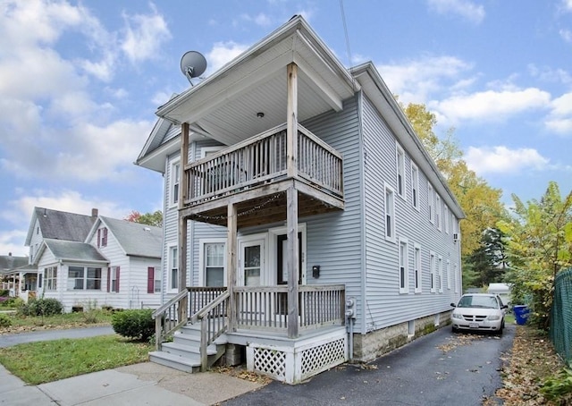 view of front of home with a balcony