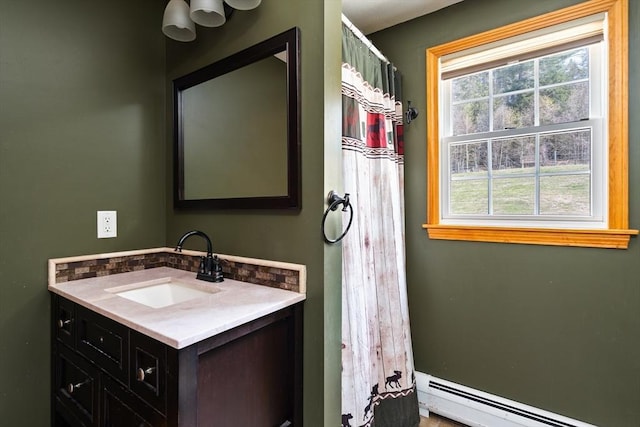 full bathroom featuring vanity, a shower with curtain, and a baseboard heating unit