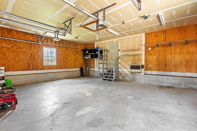 garage with heating unit and a garage door opener