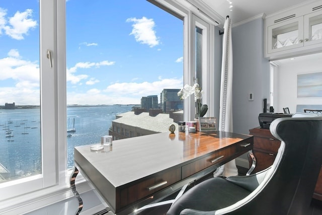 interior space featuring a water view and crown molding