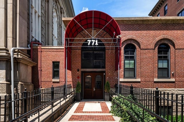 view of exterior entry featuring french doors