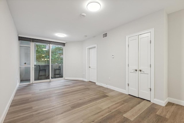 empty room featuring light hardwood / wood-style floors