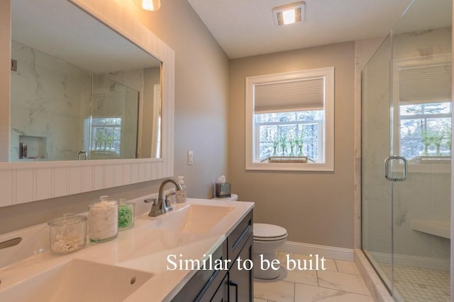 bathroom with vanity, toilet, and walk in shower