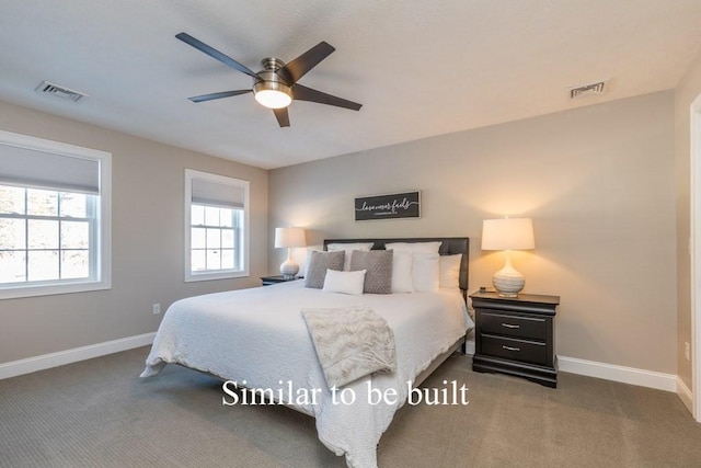 bedroom featuring dark colored carpet and ceiling fan