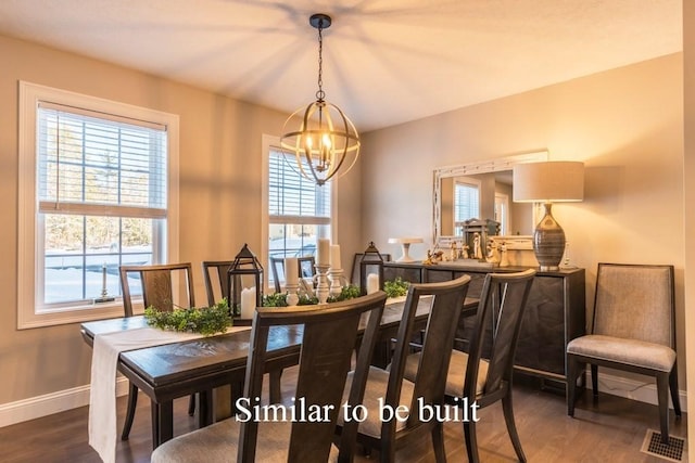 dining area with a wealth of natural light, dark wood-type flooring, and a chandelier