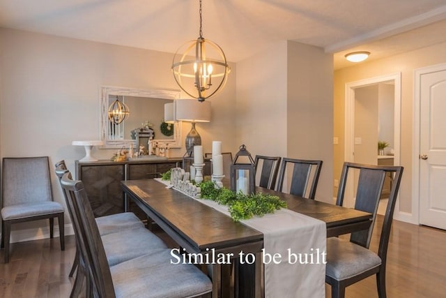 dining area with hardwood / wood-style flooring and an inviting chandelier