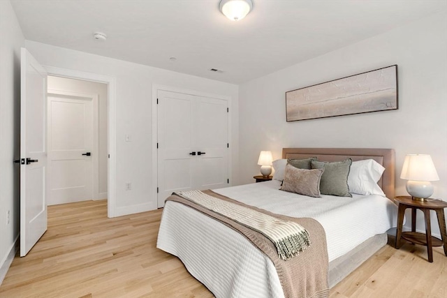 10 Sylvan Hill Xing, Haverhill, MA 01832 - bedroom with light wood-style floors, baseboards, and a closet