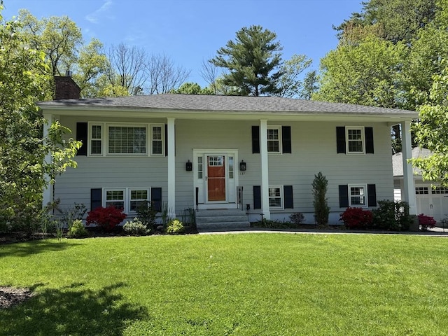 137 Naugler Ave, Marlborough, MA 01752 - split foyer home featuring a chimney and a front lawn
