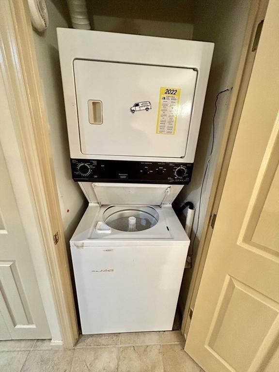 97 Anderer Ln Unit 105, Boston, MA 02132 - laundry room featuring laundry area and stacked washer and clothes dryer