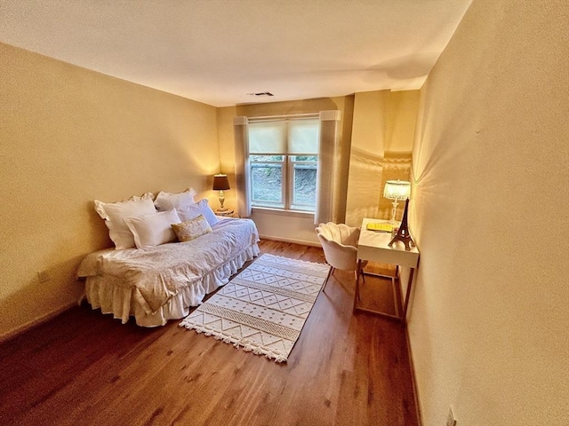 97 Anderer Ln Unit 105, Boston, MA 02132 - bedroom featuring a textured wall, wood finished floors, and visible vents