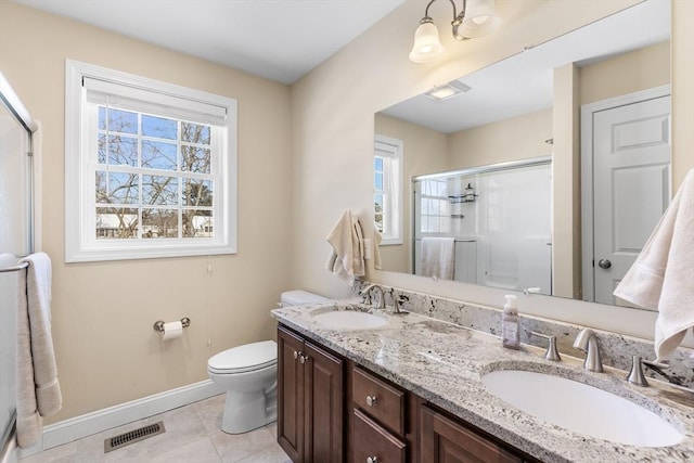 full bathroom with a wealth of natural light, visible vents, and a sink