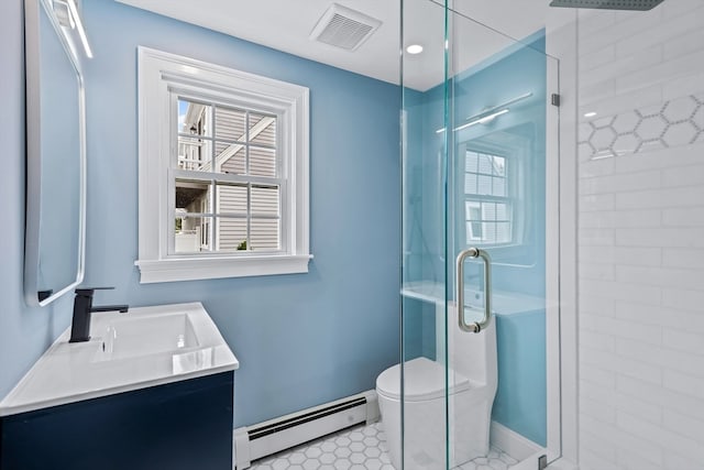 bathroom featuring vanity, baseboard heating, toilet, and a shower with door