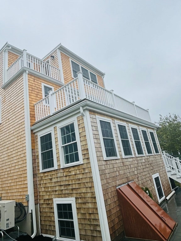 view of property exterior featuring a balcony