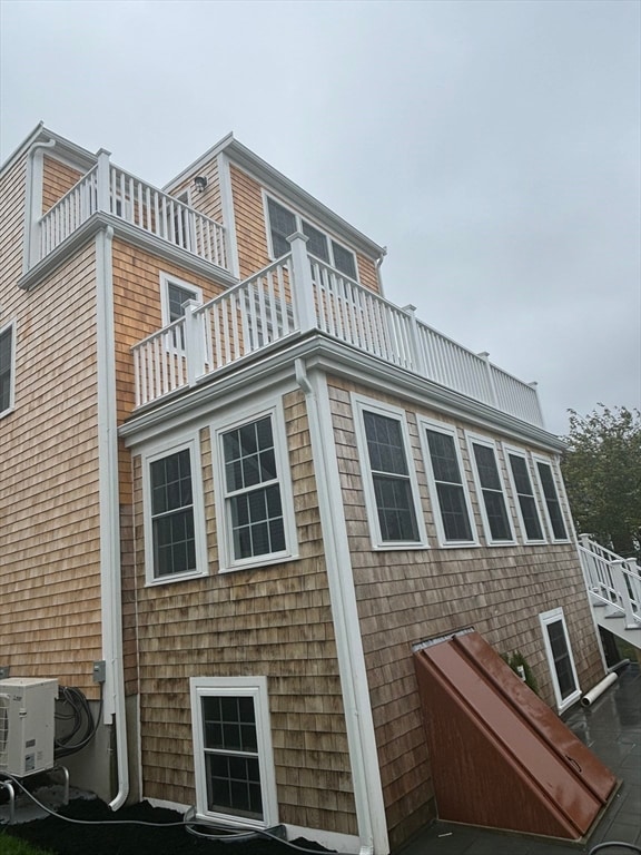 view of side of home with a balcony