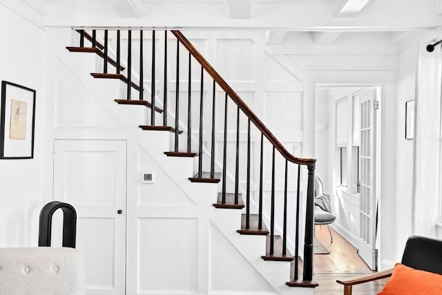 stairway with hardwood / wood-style floors