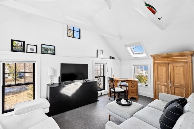 living room with beamed ceiling, a skylight, and high vaulted ceiling