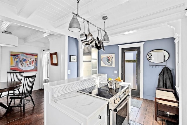 kitchen with hanging light fixtures, beam ceiling, electric range, white cabinets, and dark hardwood / wood-style flooring