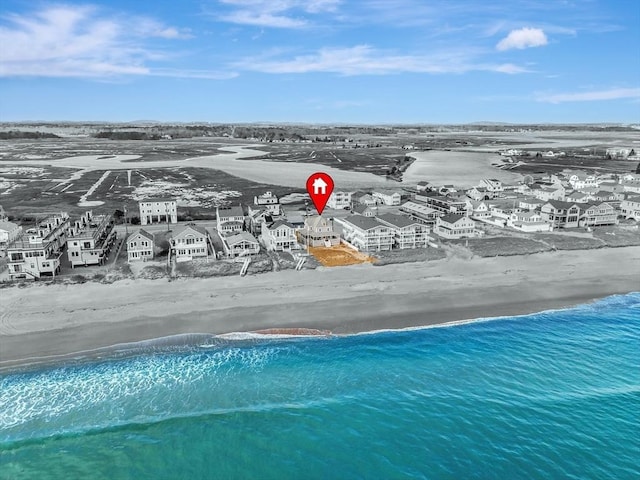 aerial view featuring a water view, a residential view, and a view of the beach