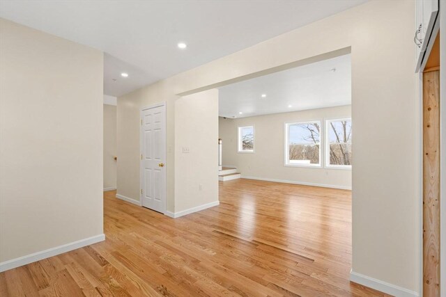 unfurnished room featuring light wood-style flooring, recessed lighting, and baseboards