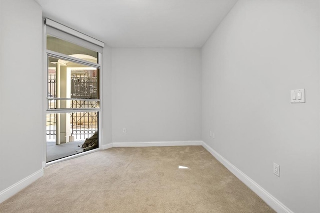 unfurnished room with light colored carpet