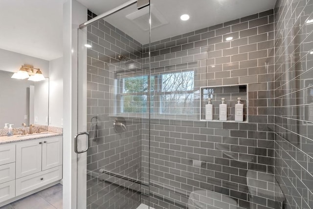 full bathroom featuring tile patterned flooring, a shower stall, vanity, and recessed lighting