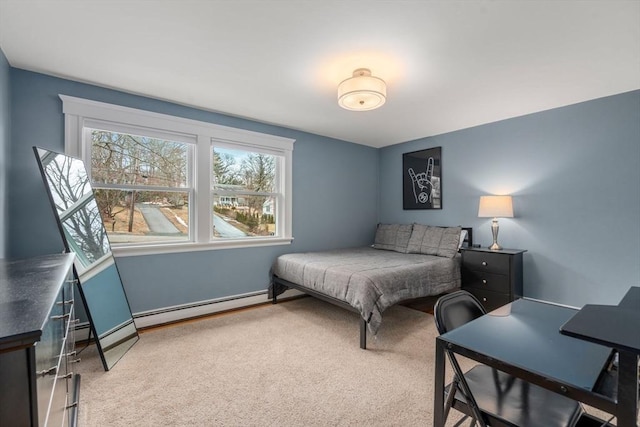 carpeted bedroom featuring baseboards and baseboard heating