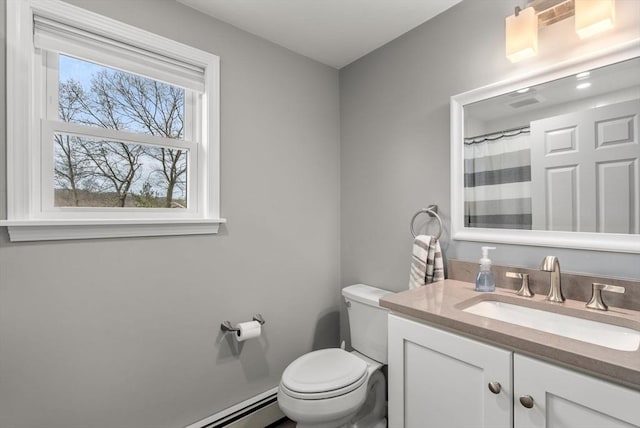 bathroom featuring curtained shower, vanity, and toilet