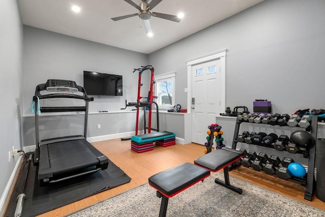 workout area with recessed lighting, ceiling fan, baseboards, and wood finished floors