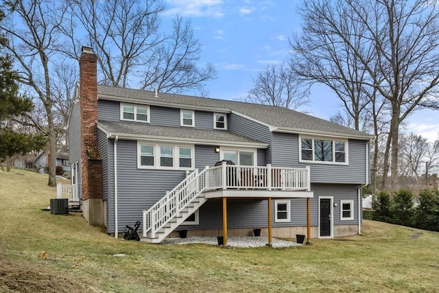 back of property featuring central AC unit, stairway, a lawn, a wooden deck, and a chimney