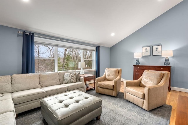 living room with lofted ceiling, light wood-style flooring, recessed lighting, baseboards, and baseboard heating