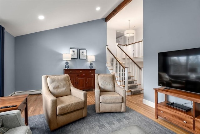 interior space with a baseboard heating unit, beam ceiling, stairs, and wood finished floors