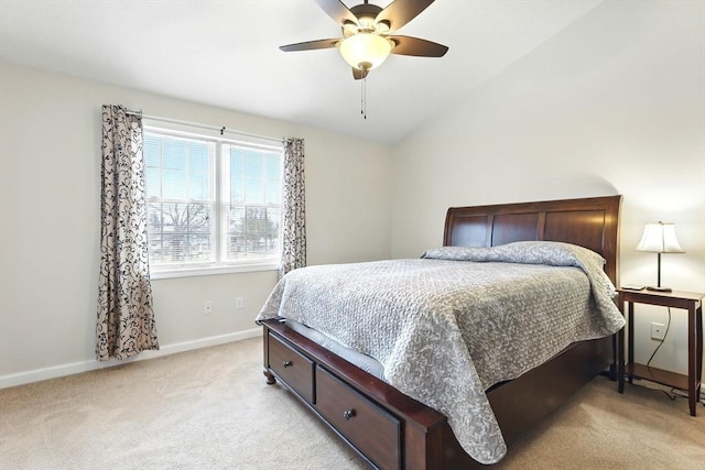bedroom featuring baseboards, a ceiling fan, lofted ceiling, and light colored carpet