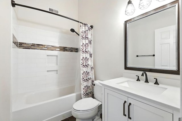 bathroom featuring toilet, visible vents, shower / bath combination with curtain, and vanity