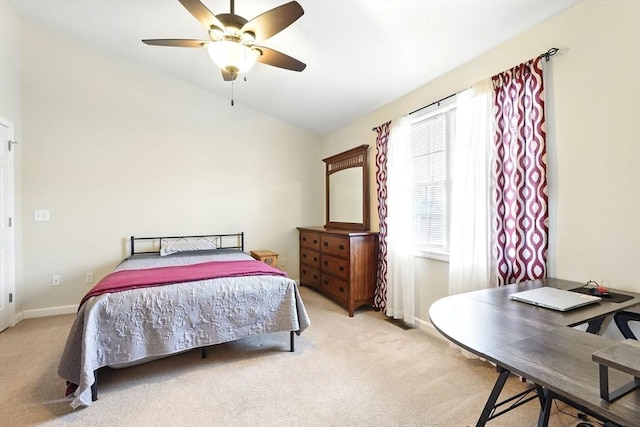 bedroom with baseboards, light carpet, ceiling fan, and lofted ceiling