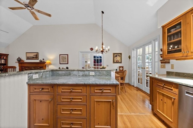 21 Gramps Way, Chatham, MA 02659 - kitchen featuring stainless steel dishwasher, french doors, lofted ceiling, light wood-style flooring, and glass insert cabinets