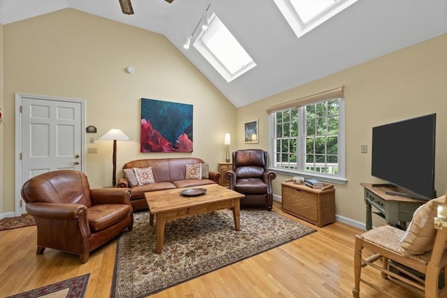 21 Gramps Way, Chatham, MA 02659 - living area with a skylight, light wood-style floors, and high vaulted ceiling